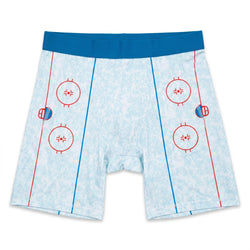 Flat lay of hockey shorts with a rink design