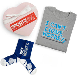 Gray t-shirt with 'I Can't, I Have Hockey' text, blue socks with 'Just Hockey' text, and pink heart-shaped box with SportzBox logo.