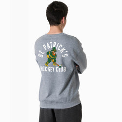 Person wearing a gray sweatshirt with 'St. Patrick's Hockey Club' design on the back.