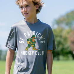 Child wearing a gray St. Patrick's Hockey Club t-shirt outdoors