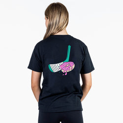 Person wearing a black t-shirt with a colorful hockey donut graphic on the back