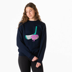 Person wearing a navy blue sweatshirt with a colorful hockey donut graphic design on a white background