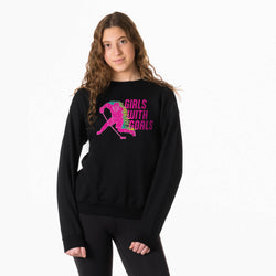 Person wearing a black sweatshirt with 'Girls with Goals' graphic design.