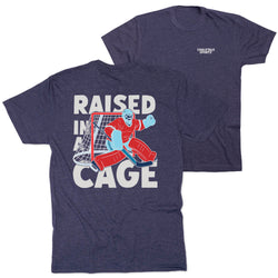 Navy t-shirt with graphic of a hockey goalie and 'Raised in a Cage' text on a white background