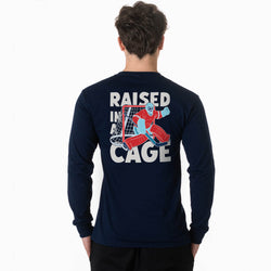 Navy long-sleeve shirt with 'Raised in a Cage' graphic on the back, worn by a person.