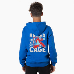 Person wearing a royal blue hoodie with a graphic and text on the back, on a white background