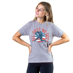 Girl wearing a gray t-shirt with a hockey graphic design and 'All Grit No Quit' text on a white background