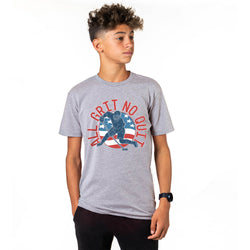 Person wearing a gray t-shirt with a hockey graphic on a white background