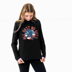 Woman wearing a black sweatshirt with a hockey graphic design on a white background