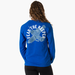 Person wearing a blue long sleeve tee with 'Fear The Keeper' graphic on the back