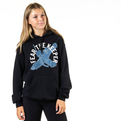 Person wearing a black hoodie with 'Fear The Keeper' graphic design on a white background