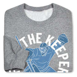 Gray folded sweatshirt with 'Fear The Keeper' graphic design on a white background