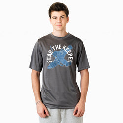 Person wearing a gray t-shirt with 'Fear The Keeper' graphic design on a white background