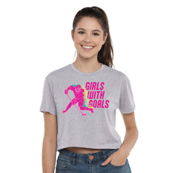 Woman wearing a gray t-shirt with 'Girls with Goals' graphic design on a white background