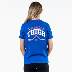 Person wearing a blue t-shirt with 'pretty tough' text and graphic on the back.