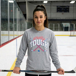 Person wearing a gray long sleeve tee with 'pretty TOUGH' text on an ice rink