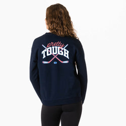 Person wearing a navy blue sweatshirt with 'pretty tough' text and hockey stick graphics on the back.
