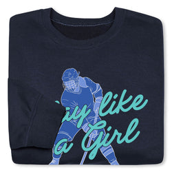 Folded navy blue sweatshirt with hockey player graphic and 'play like a girl' text on a white background