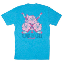 Blue t-shirt with pink floral and hockey stick design on a white background