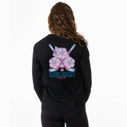 Person wearing a black long sleeve tee with pink floral and hockey stick design on the back, text 'Aloha Hockey Club' on a white background.