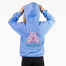 Light blue hoodie with pink floral and hockey stick design on the back, on a white background.