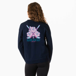 Person wearing a navy blue sweatshirt with 'Aloha Hockey' design on the back, on a white background