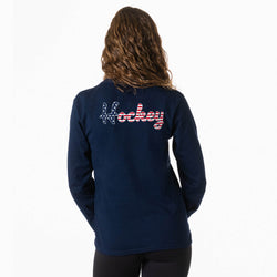 Navy blue long-sleeve shirt with 'Hockey' text on the back, worn by a person.