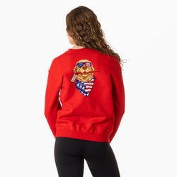 Person wearing a red sweatshirt with a graphic design on the back, on a white background