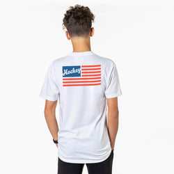 Person wearing a white t-shirt with a red, white, and blue flag design on the back against a white background