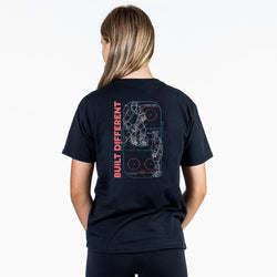 Person wearing a black t-shirt with 'Built Different' design on the back, on a white background