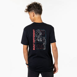 Person wearing a black t-shirt with 'Built Different' design on the back, on a white background