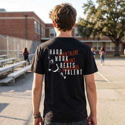 Person wearing a black short sleeve tee with 'hard work beats talent' hockey themed design on the back.