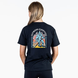 Person wearing a black t-shirt with a colorful hockey graphic and text on the back, on a white background