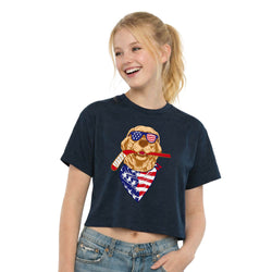 Person wearing a navy blue t-shirt with a graphic of a dog wearing sunglasses and an American flag bandana on a white background.