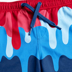 Close-up of colorful shorts with red and blue pattern.
