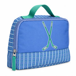 A blue and green accessory bag with a top handle, featuring a crossed hockey sticks design on the front and a patterned lower section.