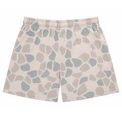 A pair of shorts featuring an irregular stone or stone-like print in beige, gray, and muted brown tones over a light peach mesh fabric, with an elastic waistband.