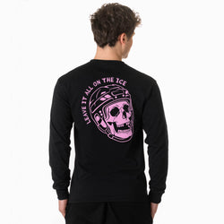 A man viewed from the back wearing a black long-sleeve shirt with a large pink graphic on the back showing a skull in a hockey helmet and the text 'LEAVE IT ALL ON THE ICE'.