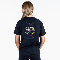 A woman viewed from the back wearing a black t-shirt with a colorful graphic on the back. The graphic features the text 'ALL GAS NO BRAKES' in white, overlaid on a stylized neon hockey rink design with yellow and pink accents.