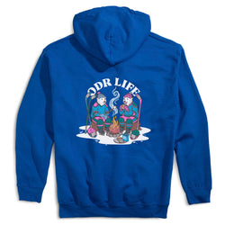 A royal blue hoodie shown from the back, featuring a colorful cartoon graphic of two people sitting by a campfire with the text 'ODR LIFE' above them.