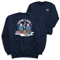 A navy blue crewneck sweatshirt shown from both the back and front. The back features a large graphic of two cartoon hockey players roasting marshmallows around a campfire, with the text 'ODR LIFE' arched above them.