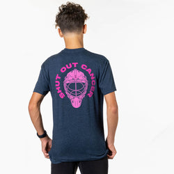 A man viewed from behind wearing a heather navy blue t-shirt with a large pink graphic on the back featuring a hockey goalie mask and the text 'SHUT OUT CANCER'.
