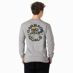 A boy viewed from the back wearing a heather gray long-sleeve t-shirt with a large graphic on the back. The graphic features a hockey player and the text 'GARBAGE GOALS'.