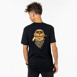 Person wearing a black t-shirt with a graphic of a dog wearing sunglasses and a camo bandana on the back.
