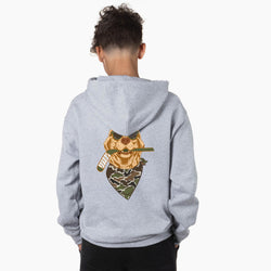A child viewed from the back wearing a light heather gray hoodie with a large graphic print on the back. The graphic shows a dog wearing sunglasses and a camouflage bandana.