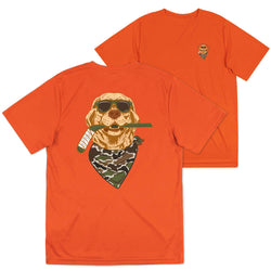 Bright orange short-sleeve t-shirt shown from the back and side, featuring a large graphic of a dog wearing sunglasses and a camouflage bandana while holding a hockey stick.