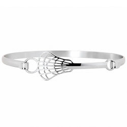 A polished silver-tone metal bangle bracelet featuring a lacrosse head design in the center, set against a plain white background.