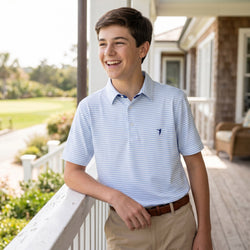Boy wearing a lacrosse themed polo shirt 