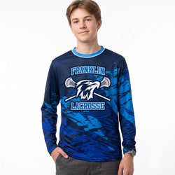 Person wearing a blue Franklin Lacrosse long-sleeve shirt with camouflage pattern on a white background