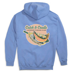 Light blue hoodie with 'Catch & Cradle Lacrosse Fishing Club' graphic on the back